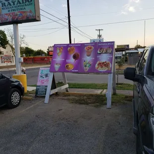 a car parked in front of a restaurant