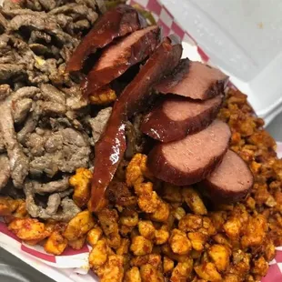 Bistec loaded fries with add pastor and sausage