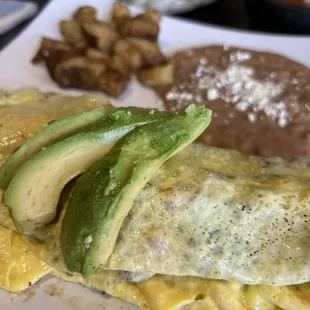 an omelet with avocado and beans