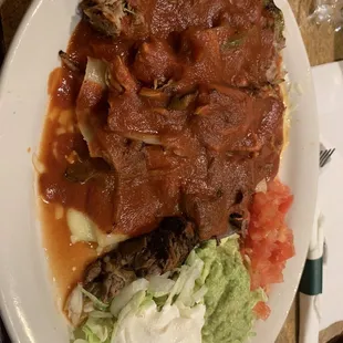 Three enchiladas with mystery red sauce... not good