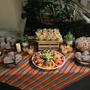 Street corn, fresh fruit, flan, churros and cheesecake.