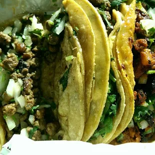 Two steak and one Al pastor tacos, the mobile truck.