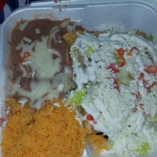 Tacos Dorados with rice and beans.