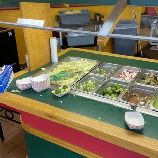 a salad bar with a variety of salads