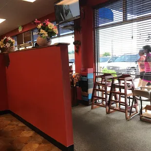 a woman walking through a restaurant