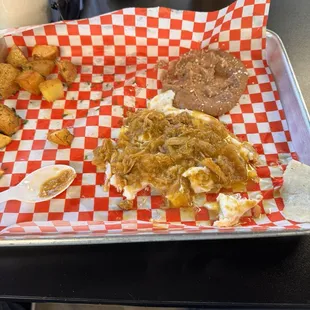 Chicharron over eggs