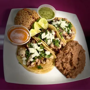 TACO PLATE : it comes 3 tacos choice of meat , beans , rice, two salsas on the side and limes !