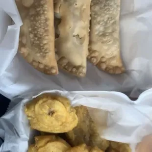 1 empanada of each meat and hot tostones