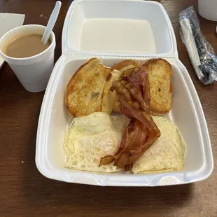 Fried eggs, bacon, bread, cafe con leche