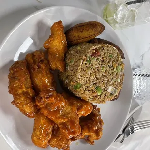 Orange chicken with Chinese rice and sweet plantains.