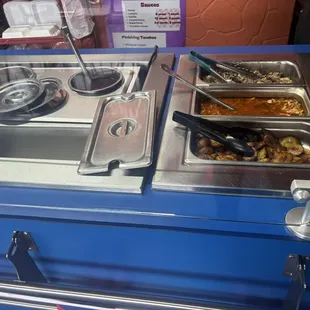 The buffet line had two meat options, two bean options, bananas, and three types of rice