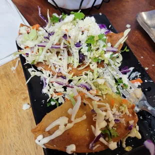 Half eaten fried tacos