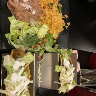 Crispy beef tacos with rice and beans