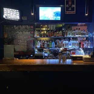 a bar with a television on the wall