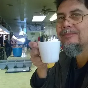 Coffee at the counter facing toward back.