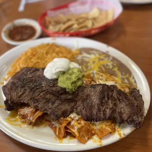 Red chilaquiles with steak