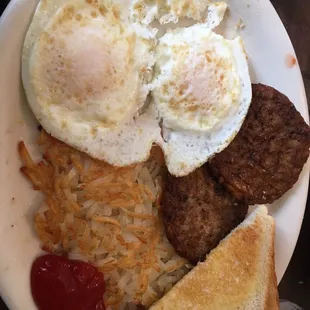 Two eggs over medium, sausage patties , hash browns and toast. My eggs were cooked perfectly :)