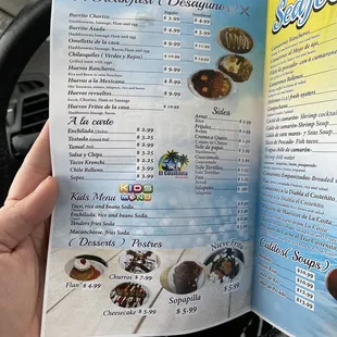 a person holding a menu
