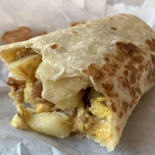 Bacon egg cheese potatoes breakfast burrito