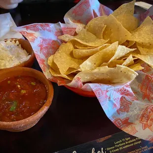Fresh tortilla chips served with salsa and coleslaw