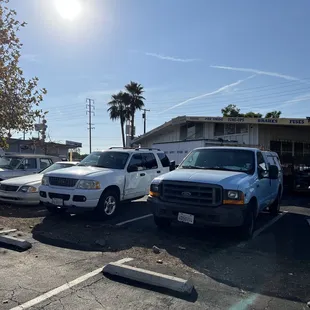 a row of trucks parked in a parking lot