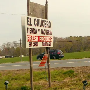 a sign on the side of the road