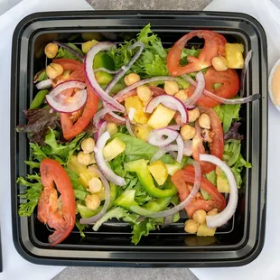 a salad in a plastic container