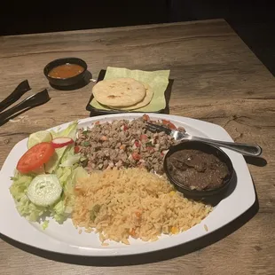 Salpicon Rico, a diced beef mixed with tomatoes, onions, radish and fresh lemon.  Rice beans and tortillas