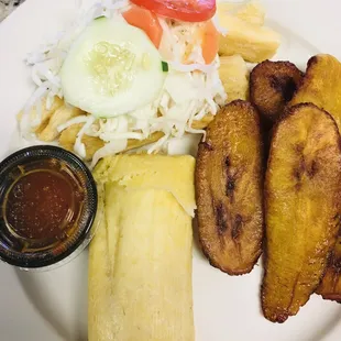 Combo yucca fries, cabbage slaw, corn tamale, plantains