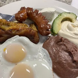 Eggs plantains avocado beans cream and cheese