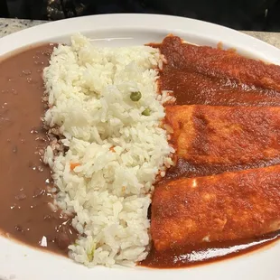 Chicken enchiladas with beans and rice.  She ordered hers dairy free.