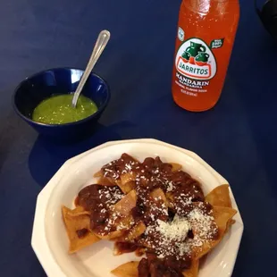Complimentary chips and salsa verde and mandarin Jarito