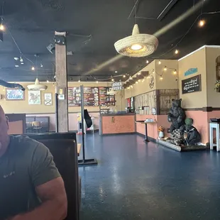 a man sitting at a table in a restaurant