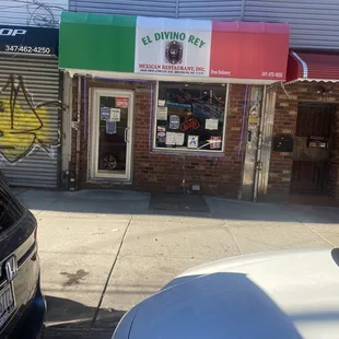 a car parked in front of a restaurant