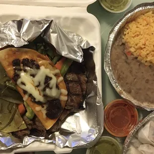 Grilled Beef w/ cheese enchilada topped w/ mole sauce &amp; vegetables served with guacamole &amp; rice and beans and tortilla (not pictured)