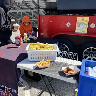  man standing at a table with food