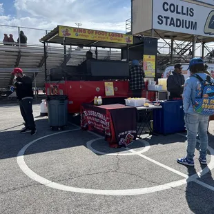  man standing in front of a food stand