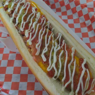 a hot dog with condiments