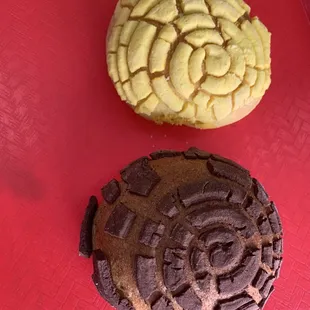 two cookies on a red table
