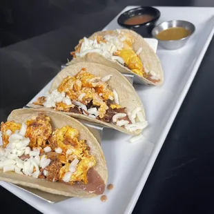 Our Breakfast Tacos! Start your day right by having eggs, beans, cheese and chorizo!