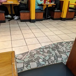 They remove the middle tables to make to give some distance between the diners.