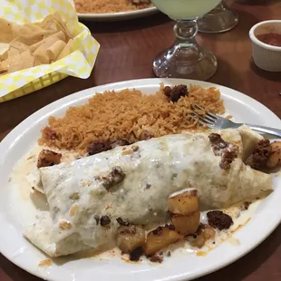 Full blown burrito with chicken steak shrimp and pineapple.