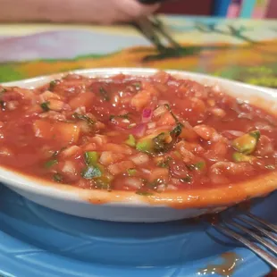 Ceviche according to server.  More a bowl of oversweet catsup and minced onion with wilted cilantro.