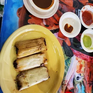 Pork and chiken tamales with red mole $10  Yummmmmmmmm
