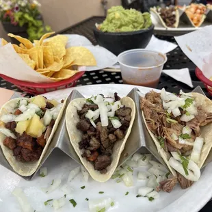 Al pastor, Carne Asada, and Carnitas tacos