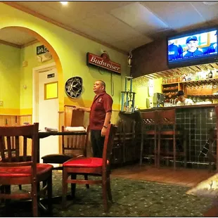 Smaller dining area near the bar. I don&apos;t know what that guy&apos;s function was but he stood like that almost the whole time.