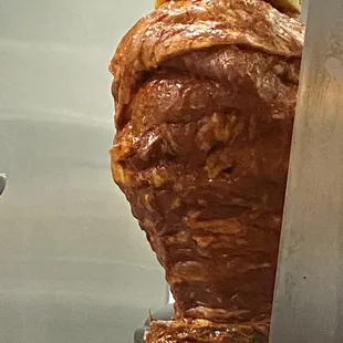 Close up of the new pork on the spit.