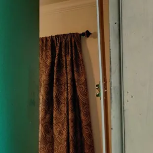 The hanging door frame with exposed nails.