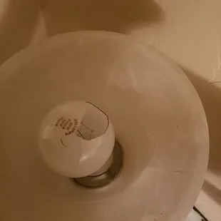 Broken light bulbs found in fixtures. (Found 2 in different locations along with other fixtures bulbs being burnt out or missing entirely )