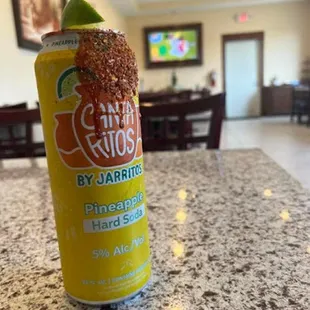 a can of salsa with a lime on top